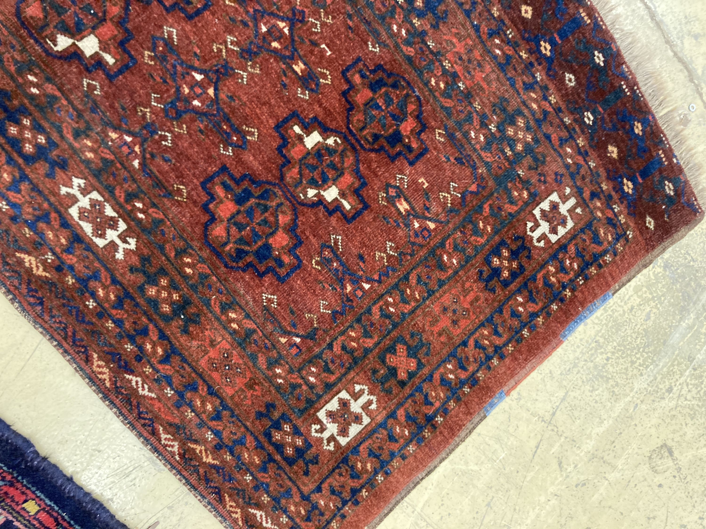 An antique Tekke burgundy ground rug, 150 x 92cm